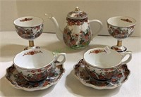 Beautiful tea set includes small tea pot, two