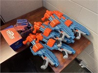 GROUP OF NERF GUNS AND DARTS
