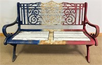 HEAVY CAST IRON BENCH W  ACADIAN FLAG PAINTED BACK