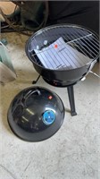 Small round charcoal grill, measures 14 inches in