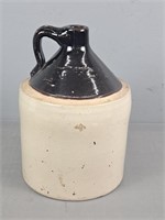 Brown And White Pottery Whiskey Jug