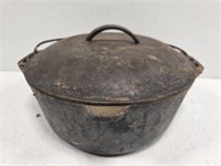 Vintage cast iron pot with lid