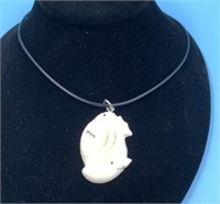 Ivory pendent and cord             (N 63)