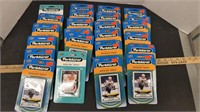 24 Unopened packs of Hockey Cards.
