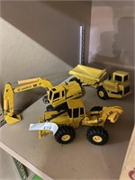 John Deere diggers and cat dump truck