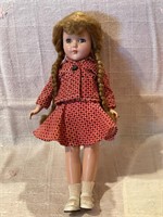 Antique doll with corduroy dress