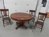 Antique table on casters (48") with 3 chairs