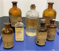 Tray lot of antique medicine bottles with