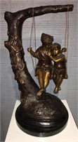 Bronze Sculpture Of Boy And Girl On Swing
