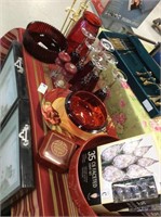 Set of red dishes glasses and decor