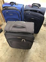 3 rolling suitcases