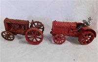 2 vintage cast iron red tractors, one has driver,