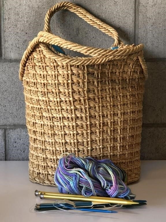 Basket with yarn and knitting needles