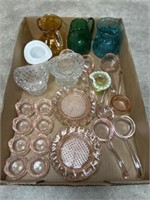 Assortment of colored glassware including butter