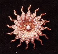 A Victorian 14K yellow gold starburst pin with