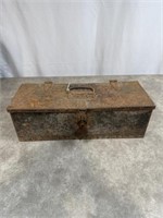 Vintage metal toolbox with assortment of tools