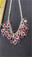 Silvertown and red rhinestone necklace.
