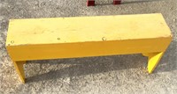 Yellow wooden bench