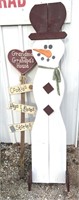Outdoor snowman decor with sign