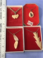 Lot with 4, fossilized ivory pendants, various sha