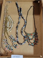 FLAT OF COSTUME JEWELRY NECKLACES