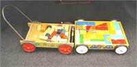 Two vintage wooden carts with building blocks
