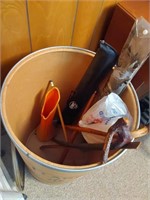 cardboard barrel with canes and pool sticks