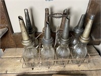 (8) glass oil jars with wire rack