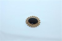 Golden Toned Oval Brooch or Pin with Black Oval St