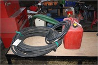 Gas can, garden hoses, air hose