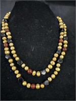 Extremely heavy gold dyed natural pearls, jet