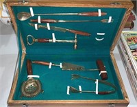 Wood travel box full of brass bar tools