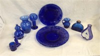 Collection of blue glass plates and items