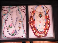 Two containers of beaded jewelry including