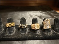 FOUR SZ 7 FASHION RINGS, SEE PHOTOS FOR MORE