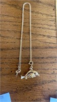 14 k chain with 14 k Dolphins charm. 18 inch