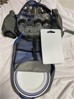 Picnic backpack has wine glasses, cutting board,