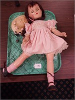Vintage composition doll with sleep eyes and