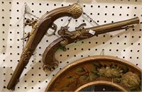 Pair of ornamental metal revolvers. The longest