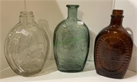 Lot of three vintage bottles including two