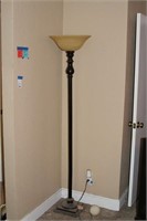 Large standing metal lamp with glass globe