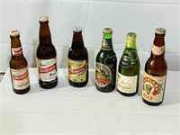 Collection of 9 vintage beer bottles