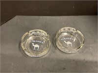 Two glass camel ashtrays