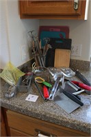 Large assortment of  utensils/cutting boards