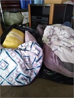 pillows and comforters in bag