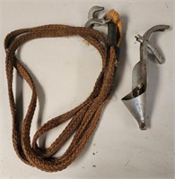Rope and vintage oil can opener funnel