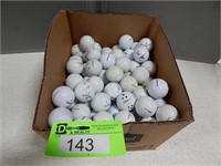 Box of used golf balls; assorted brands