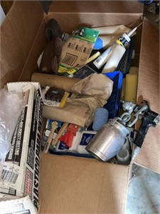 large box of painting supplies with sprayer