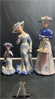 Blue and white ladies, one head is glued on