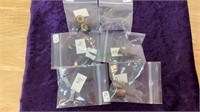 6 pairs of new ear plugs/gauges in various sizes.
